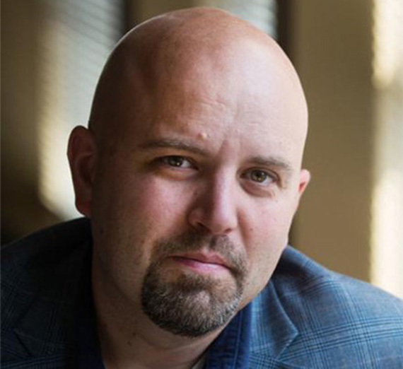 headshot of African alum Foday Kabba in suit