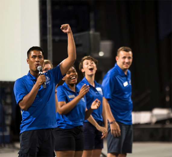 4 students of the GUide Core group speaking to an audience.