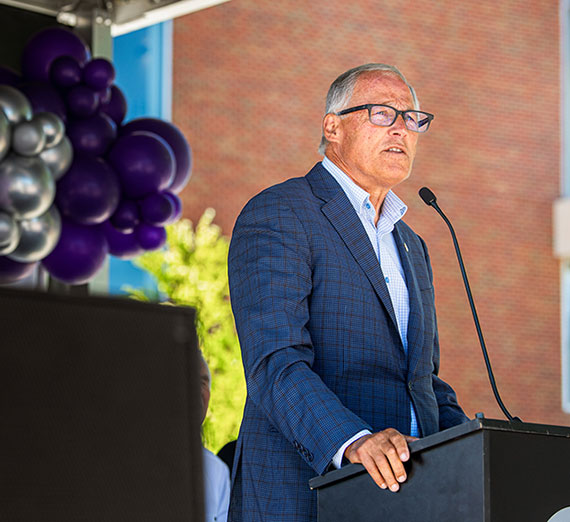 Washington Gov. Jay Inslee speaking at a podium