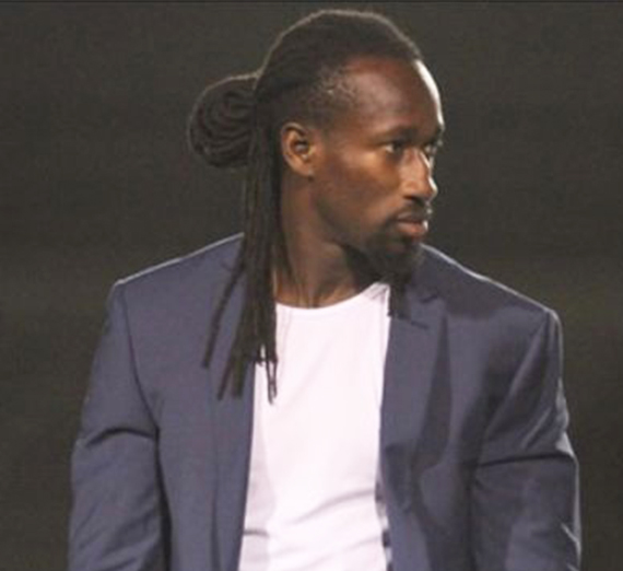 headshot of African alum Foday Kabba in suit