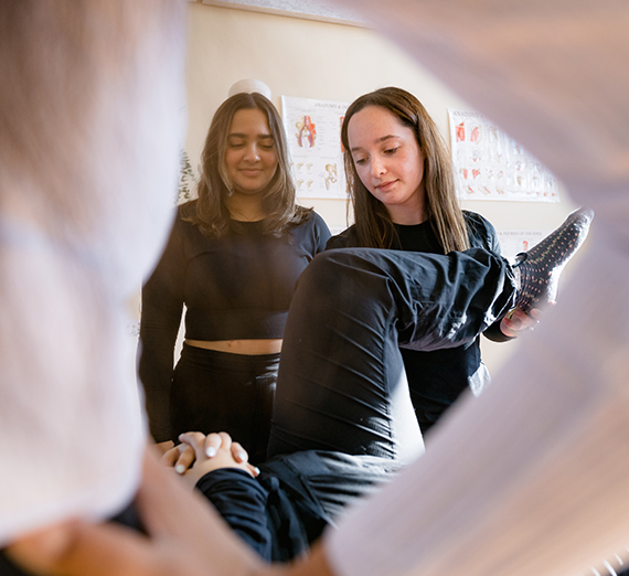 Kate Millett demonstrates proper physical therapy techniques